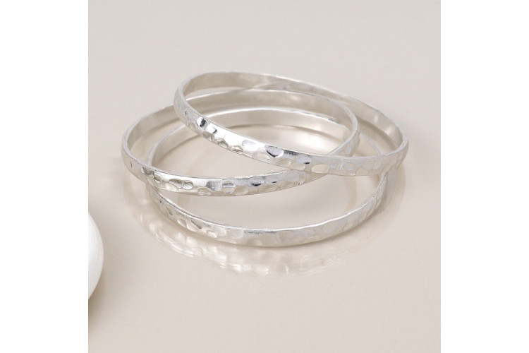 Silver plated worn triple bangle set