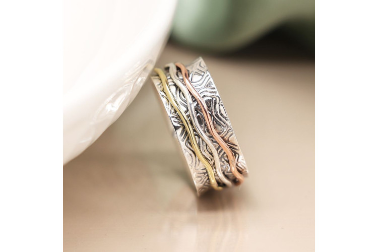 Sterling silver embossed spinning ring with triple wave band