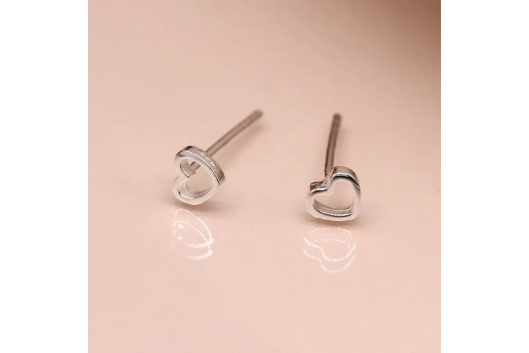 Tiny sterling silver cut out heart stud earrings