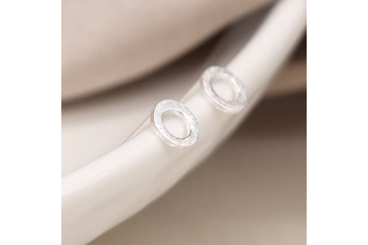 Tiny sterling silver scratched circle stud earrings